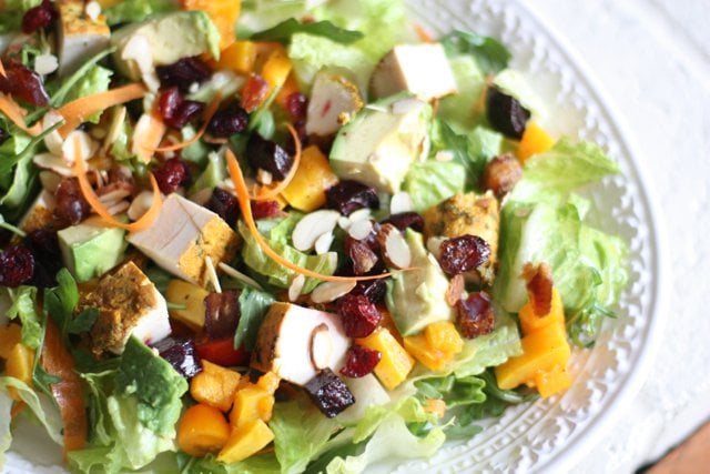Moroccan Chicken Salad loaded with dates, cranberries and avocado with a champagne vinaigrette.