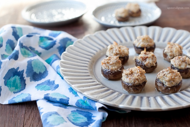 A plate of yummy crab stuffed mushrooms, gluten free and paleo.