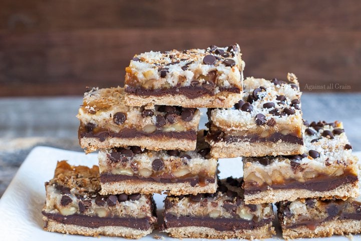 A plate of delicious seven layer bars that are gluten and egg free.