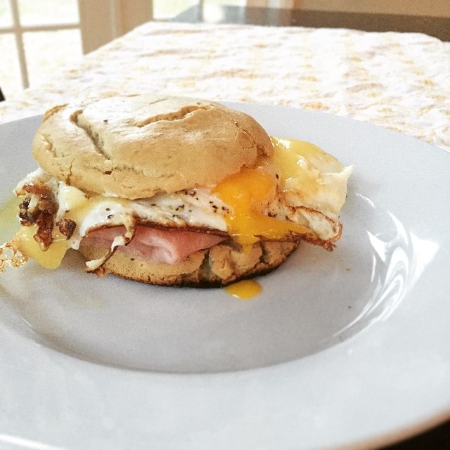 An_egg_sandwich_for_breakfast._Using_the_sandwich_rolls_from__mealsmadesimple_with_ham__raw_grass-fed_cheddar__eggs__and_mayo.__aageats