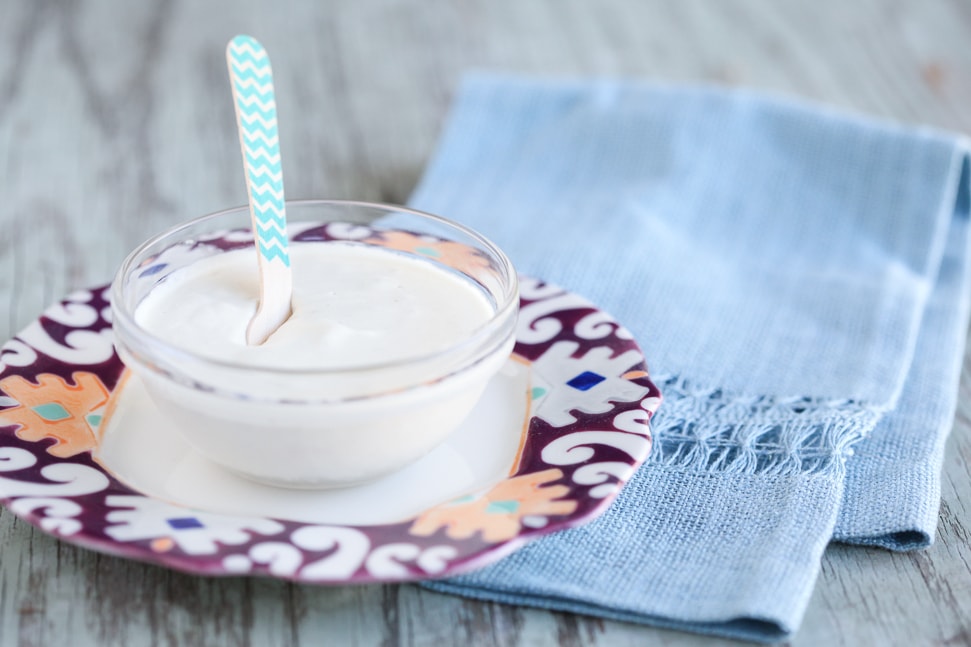 A bowl of creamy non dairy sour cream made with cashews.