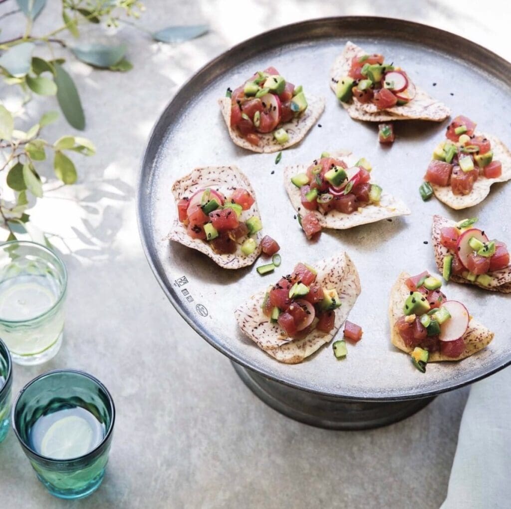 tuna tartare on taro chips displayed on a silver platter